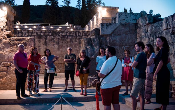 Group of tourists on a guided night tour at Medina Azahara, Córdoba.