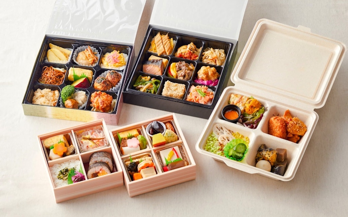 Assorted Japanese bento boxes with various dishes, related to Chanko Hot Pot tour.
