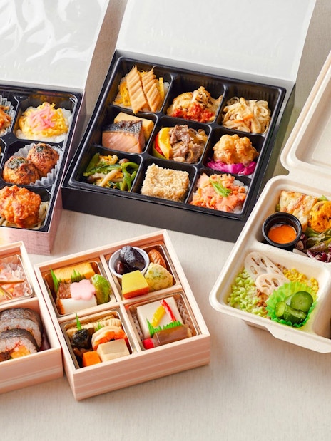 Assorted Japanese bento boxes with various dishes, related to Chanko Hot Pot tour.