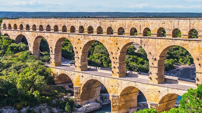 Pont du Gard ancient Roman aqueduct bridge spanning a river in southern France.