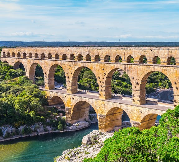 Pont du Gard ancient Roman aqueduct bridge spanning a river in southern France.