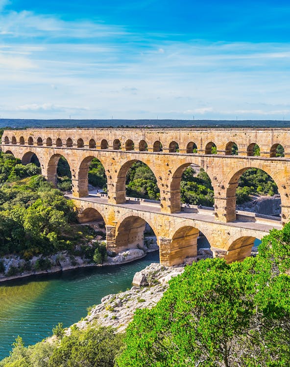 Pont du Gard ancient Roman aqueduct bridge spanning a river in southern France.