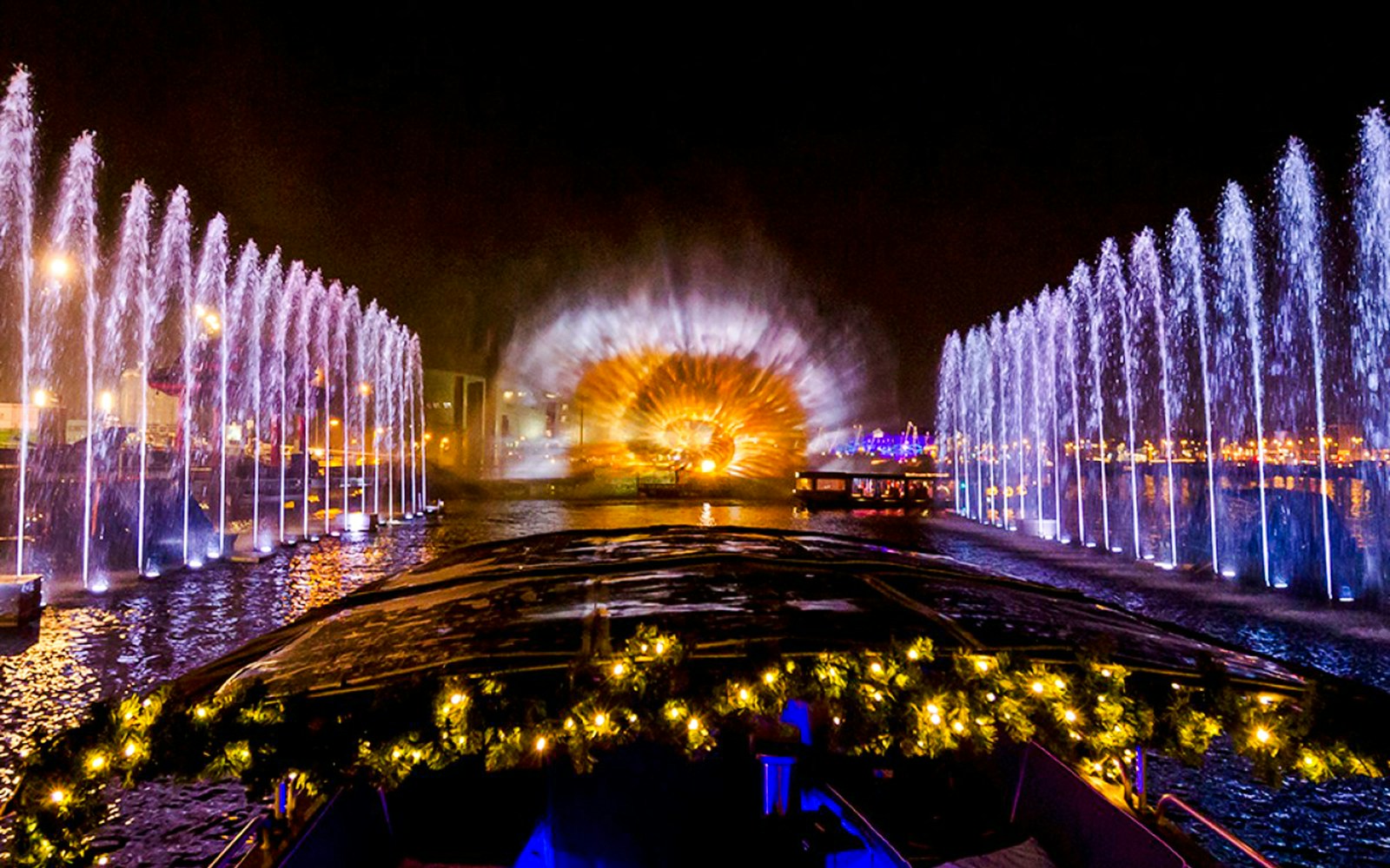Amsterdam Light Festival cruise with illuminated fountains and light display.