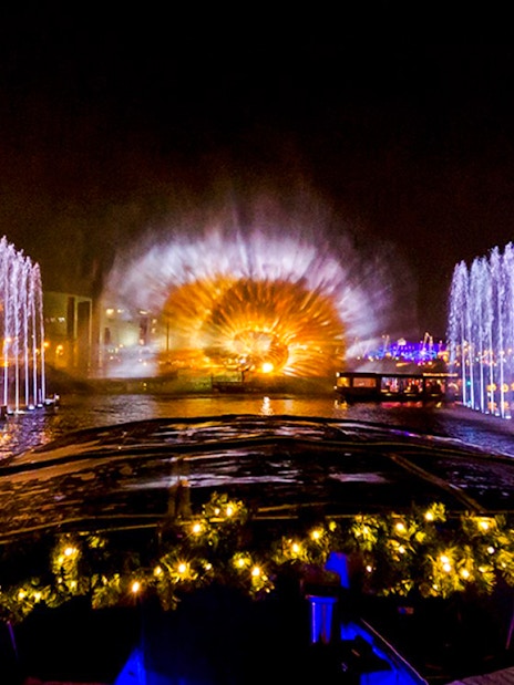 Amsterdam Light Festival cruise with illuminated fountains and light display.