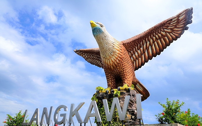 Langkawi Eagle Square statue with blue sky backdrop.