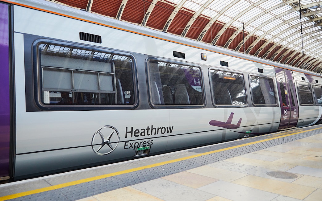 Heathrow Express train at London Paddington station platform.