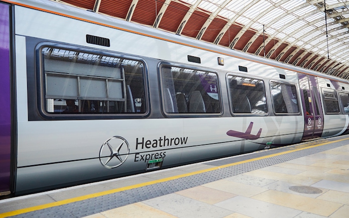 Heathrow Express train at London Paddington station platform.