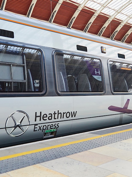 Heathrow Express train at London Paddington station platform.