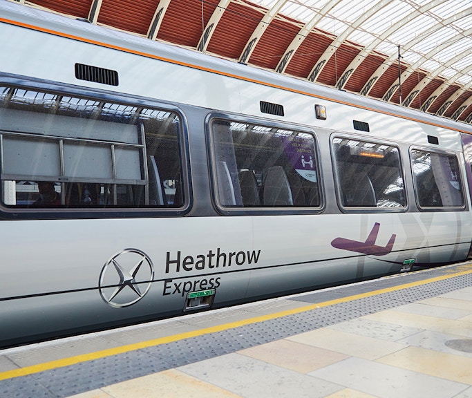 Heathrow Express train at London Paddington station platform.