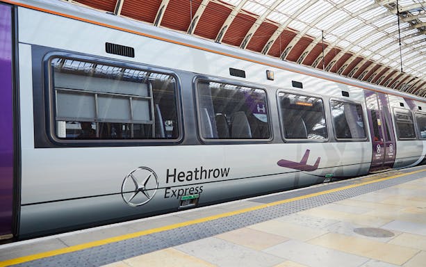 Heathrow Express train at London Paddington station platform.