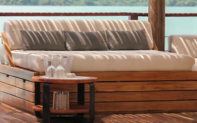Sunset terrace seating at Yona Beach Club, Phuket, with ocean view.