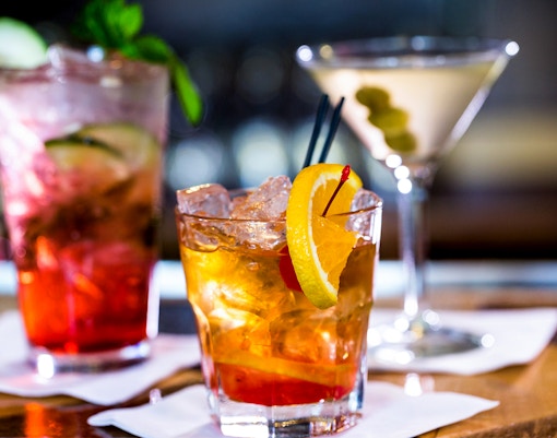 Cocktails with garnishes at Melbourne Skydeck bar.