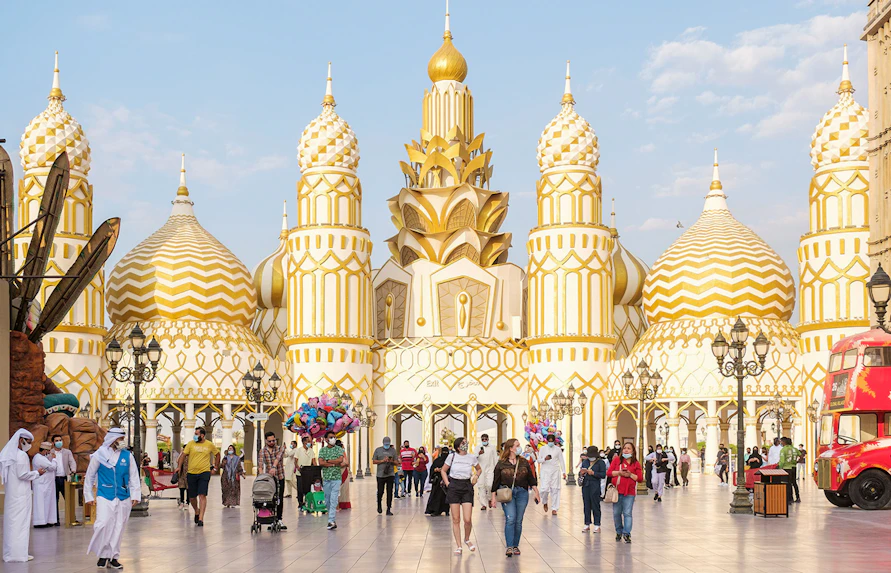 Colorful pavilions and lively crowds at Global Village Dubai, showcasing diverse cultures and attractions.