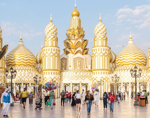 Colorful pavilions and lively crowds at Global Village Dubai, showcasing diverse cultures and attractions.