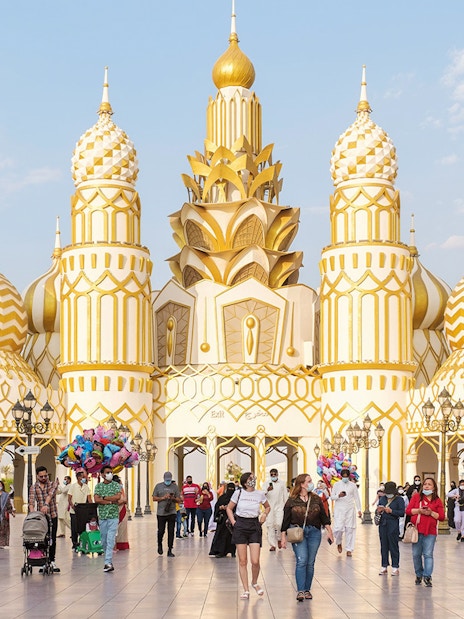 Colorful pavilions and lively crowds at Global Village Dubai, showcasing diverse cultures and attractions.