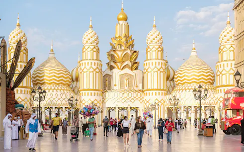 Colorful pavilions and lively crowds at Global Village Dubai, showcasing diverse cultures and attractions.