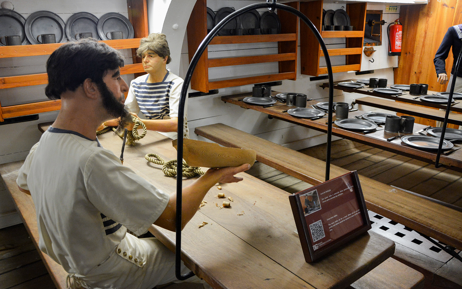 Crew members crafting ropes in the dining area of Frigate D. Fernando II e Glória.
