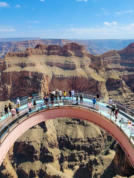 Visitors enjoying the view from the Skywalk at Grand Canyon West Rim, Arizona, USA.