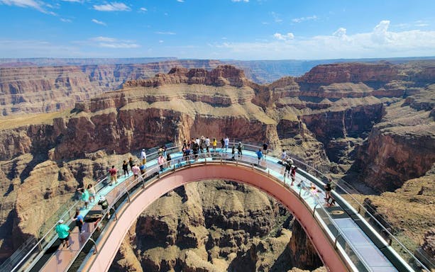 Visitors enjoying the view from the Skywalk at Grand Canyon West Rim, Arizona, USA.