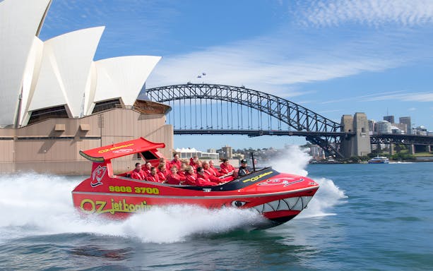 OZ Jet Boating in Sydney Harbour with Opera House and Harbour Bridge in background.