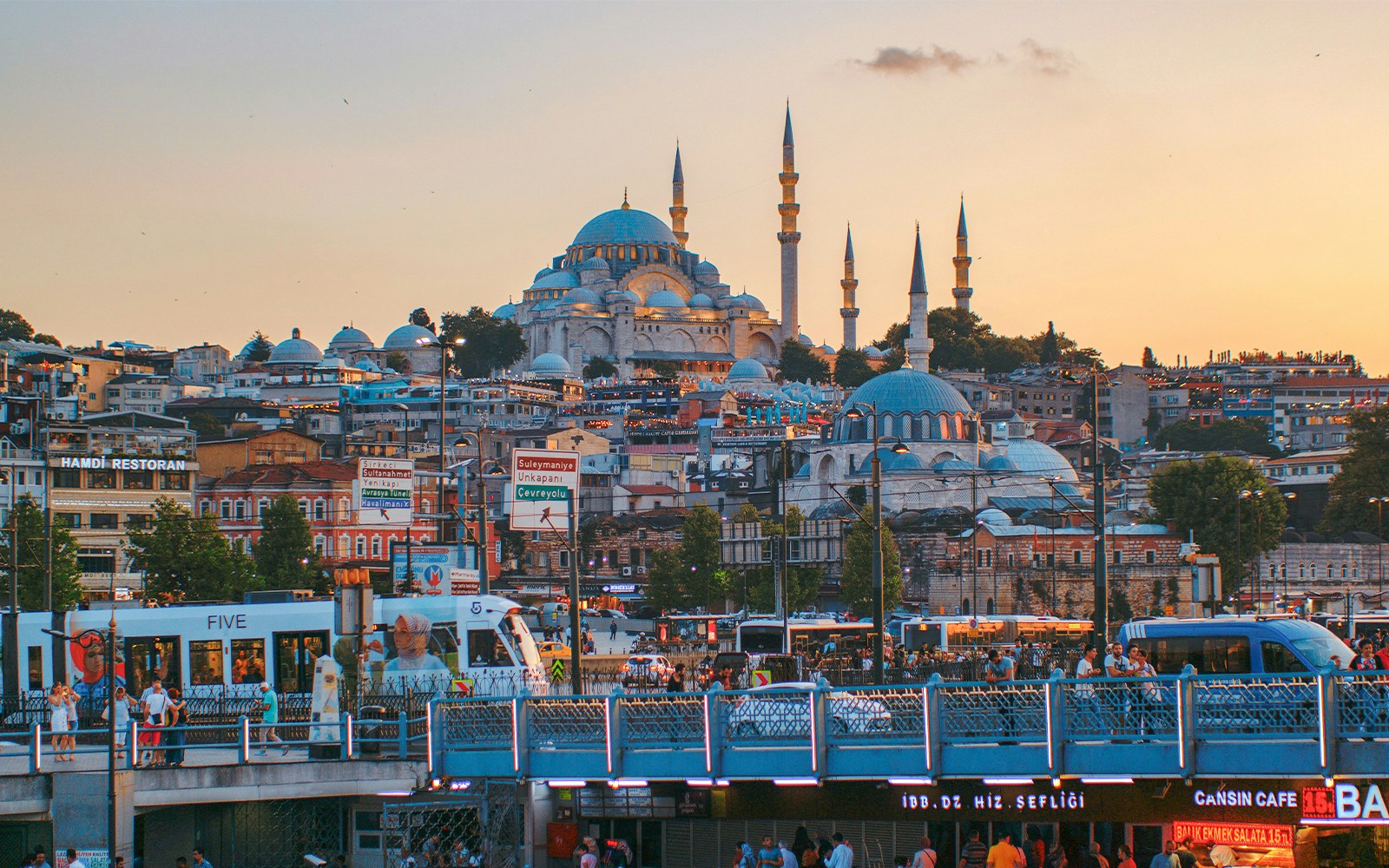 Istanbul skyline with Hagia Sophia and bustling cityscape at sunset.