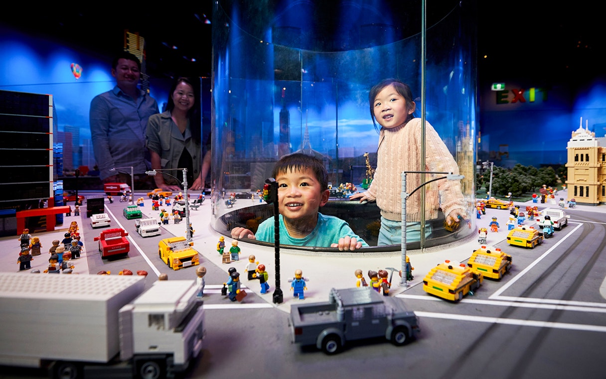 Children exploring LEGO city display at LEGOLAND Discovery Centre.
