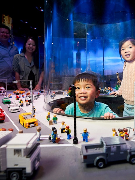 Children exploring LEGO city display at LEGOLAND Discovery Centre.