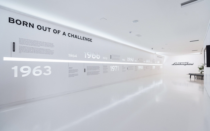 Timeline display at Ferruccio Lamborghini Museum in Bologna, Italy showcasing brand history.