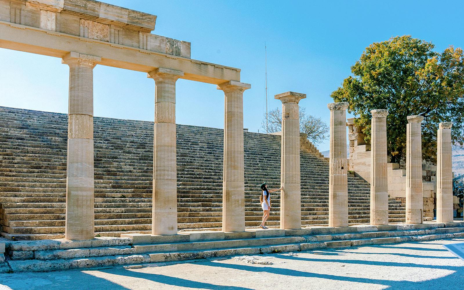 Ancient stone columns and steps at the Acropolis of Lindos, Rhodes, Greece.