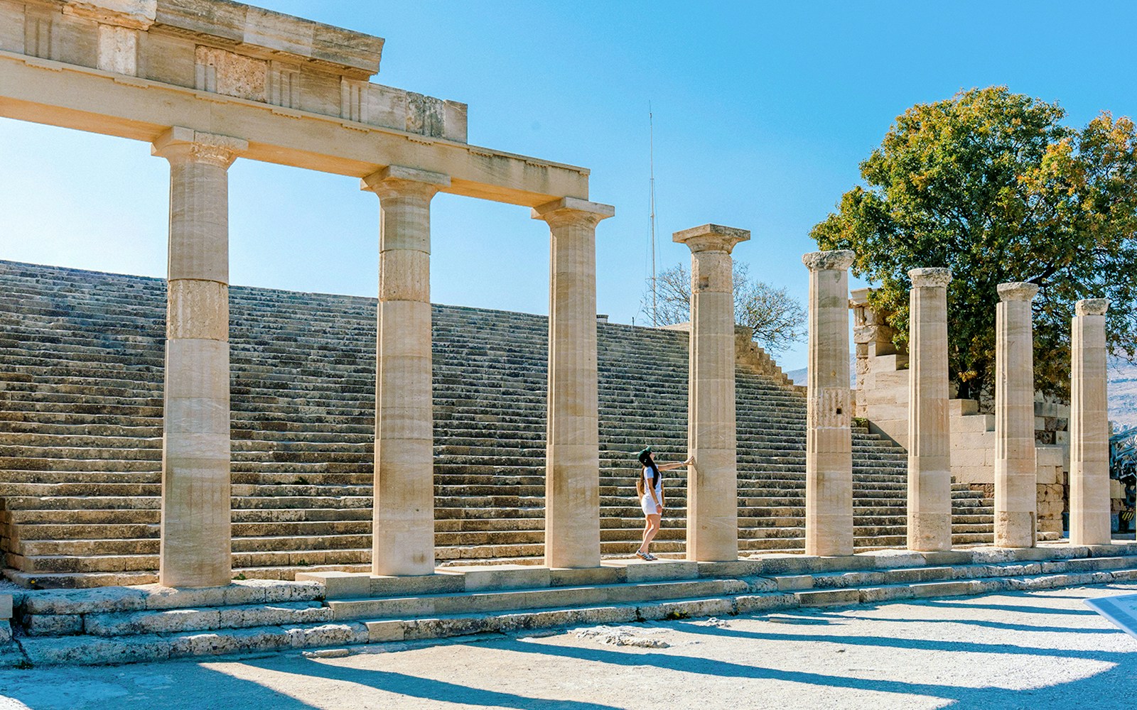 Ancient stone columns and steps at the Acropolis of Lindos, Rhodes, Greece.