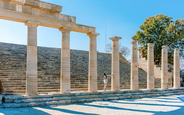 Ancient stone columns and steps at the Acropolis of Lindos, Rhodes, Greece.