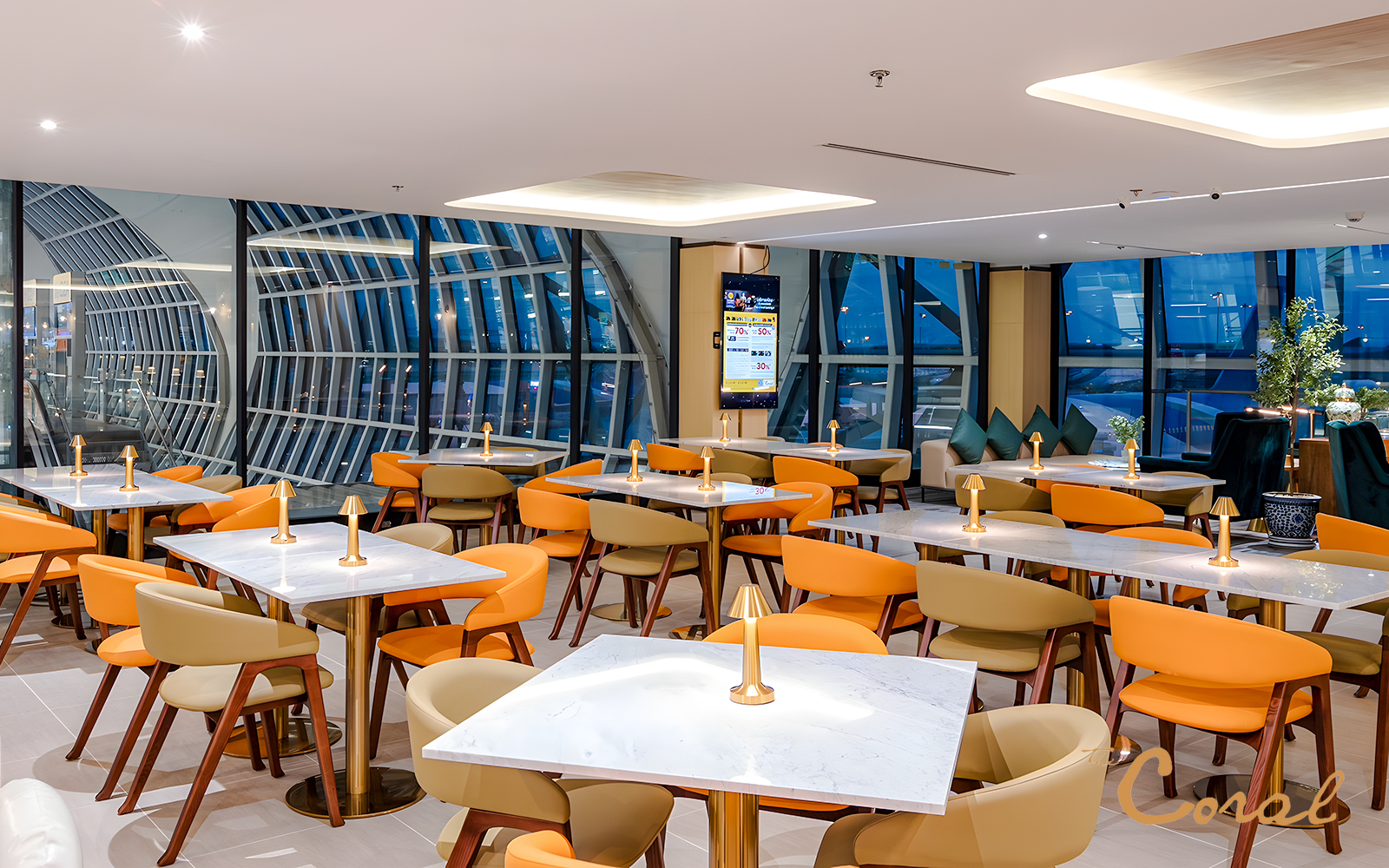 Coral Cosmo Lounge seating area with tables and chairs, Concourse C, Bangkok airport, Thailand.