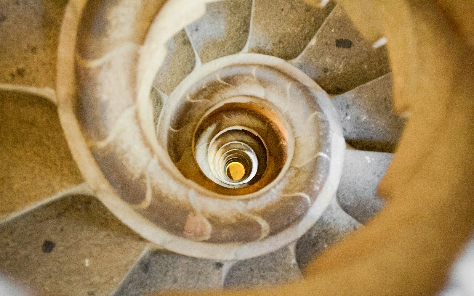 Sagrada Familia spiral staircase in Barcelona, Spain, viewed from above.