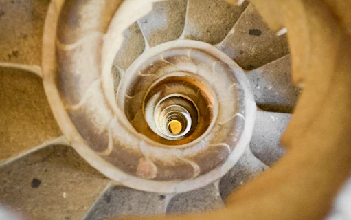 Sagrada Familia spiral staircase in Barcelona, Spain, viewed from above.