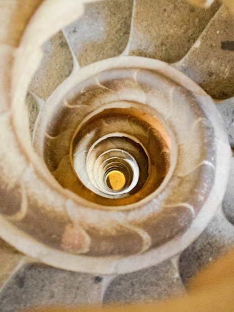 Sagrada Familia spiral staircase in Barcelona, Spain, viewed from above.