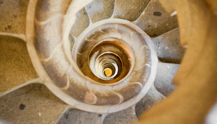 Sagrada Familia spiral staircase in Barcelona, Spain, viewed from above.