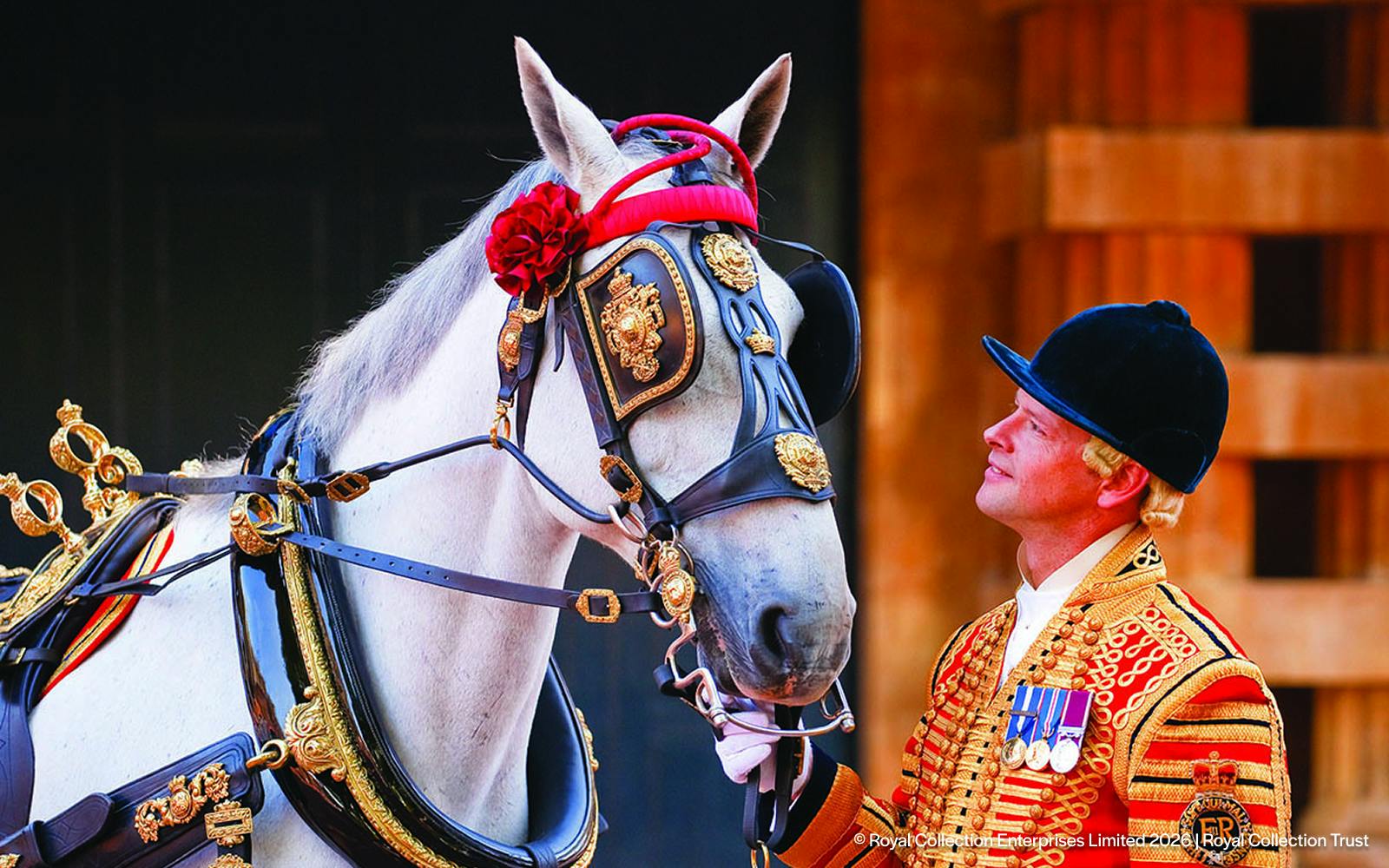 Royal guard in ceremonial attire with decorated horse at Changing of the Guard, London.