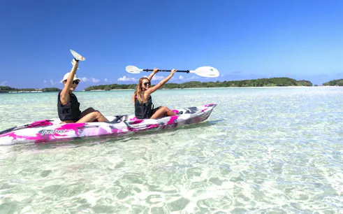Kayakers paddling in clear waters at Kabira Bay, Ishigaki, Okinawa.