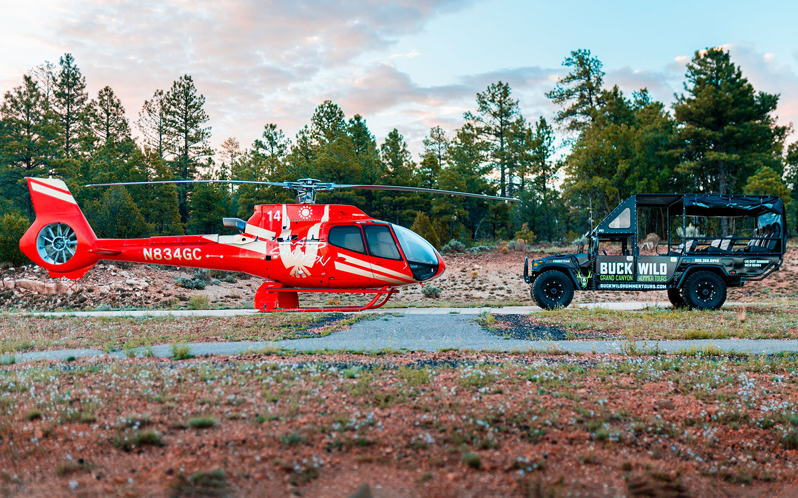 Helicopter and Hummer for Grand Kingdom tour in forest setting.