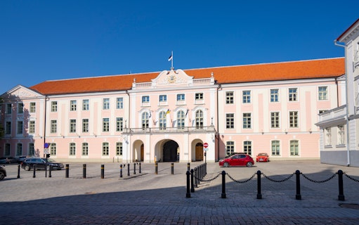 Toompea Castle facade in Tallinn, Estonia, with a clear blue sky.