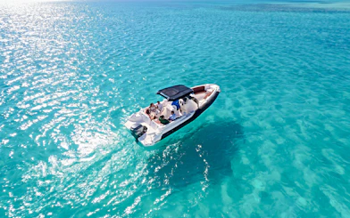 High-speed sea taxi on clear blue waters en route to Orange Bay or Magawish.