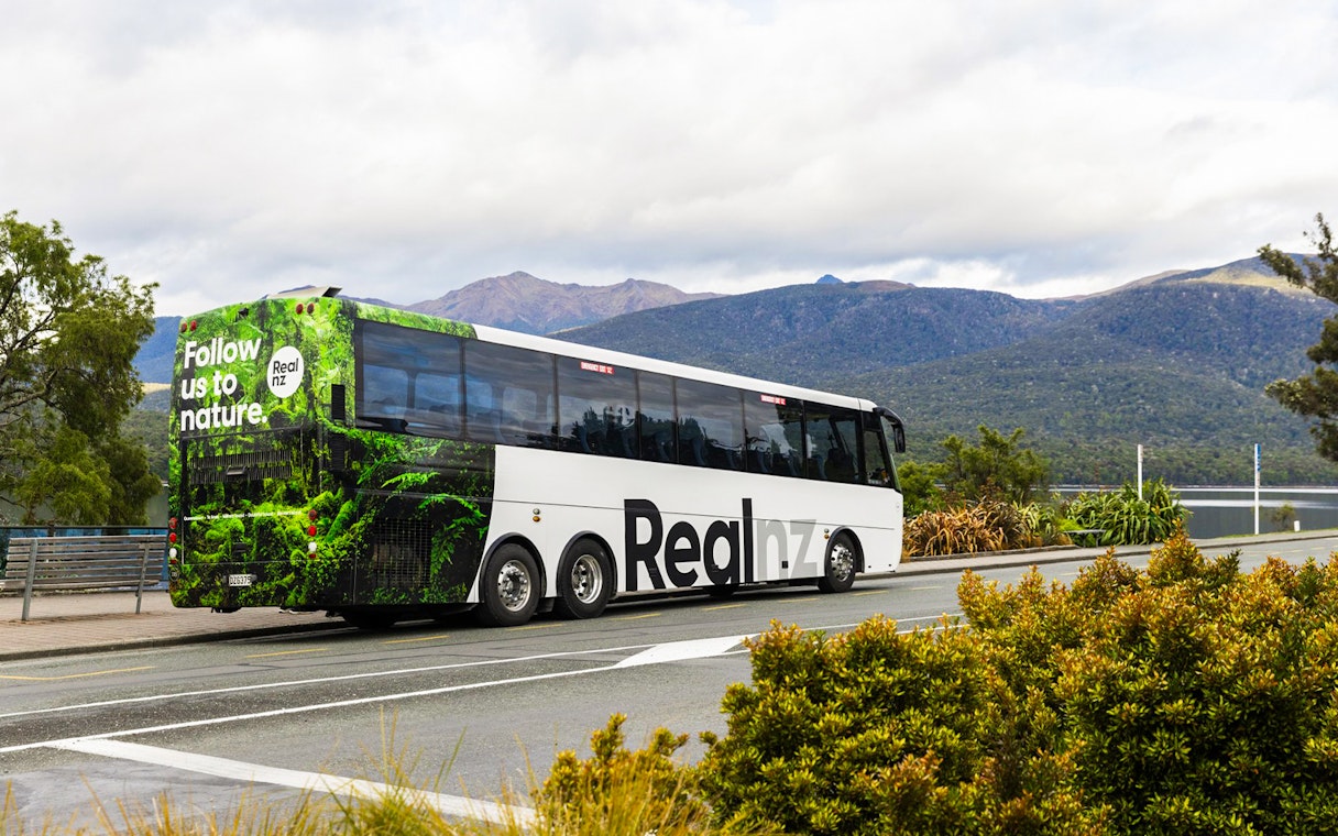Tour bus for Te Anau Premium Doubtful Sound Cruise in New Zealand's fjords.