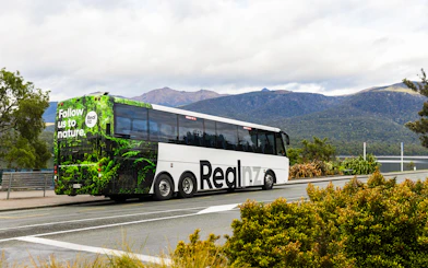 Tour bus for Te Anau Premium Doubtful Sound Cruise in New Zealand's fjords.