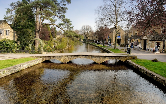 Quaint stone bridge over a river in Bourton-on-the-Water, England.