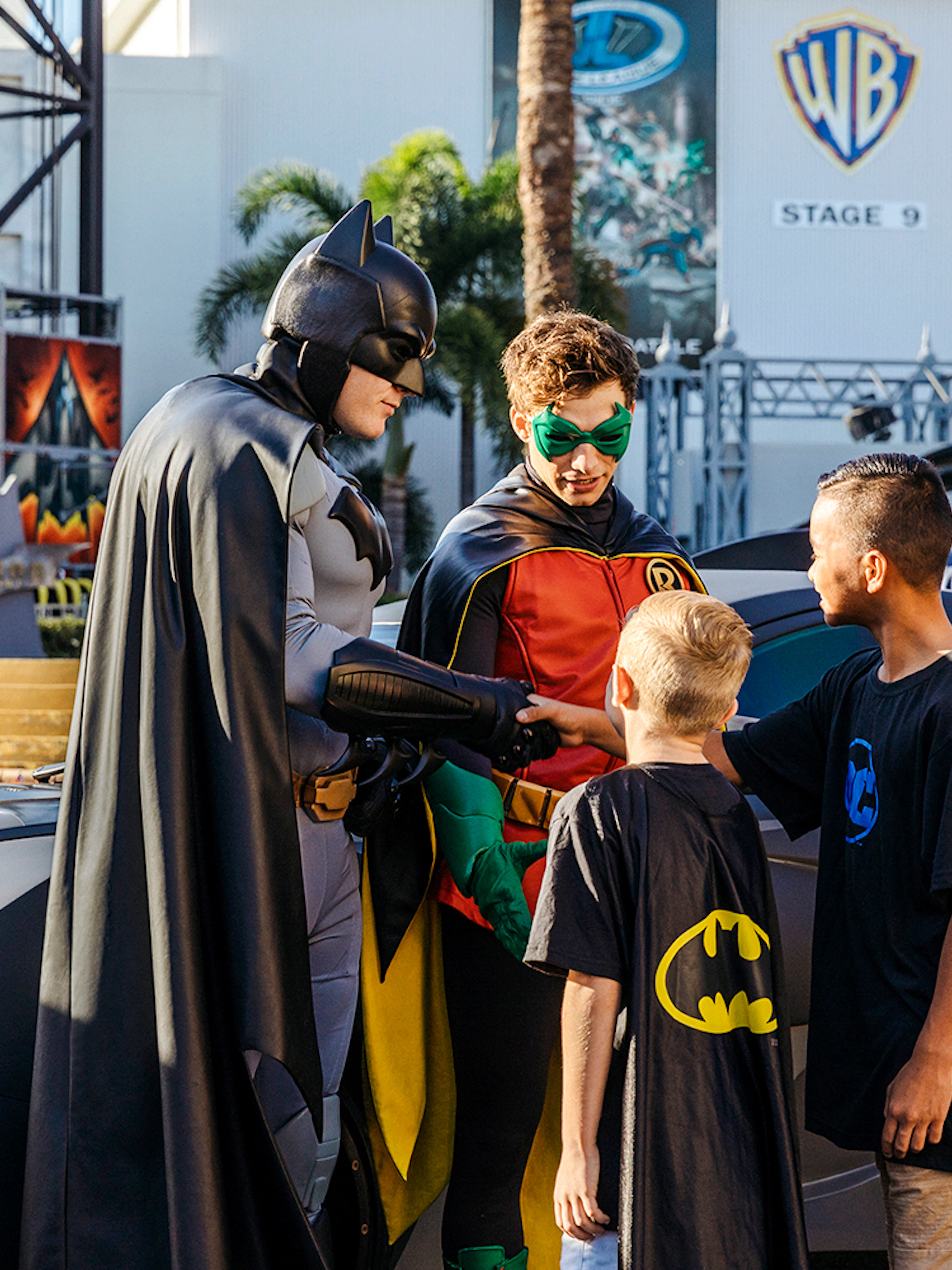 Batman and Robin greet children at Warner Bros Movie World, Gold Coast.