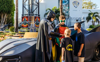 Batman and Robin greet children at Warner Bros Movie World, Gold Coast.