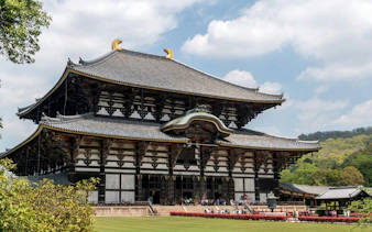 Todaiji Temple in Nara, Japan, with visitors exploring the historic site.
