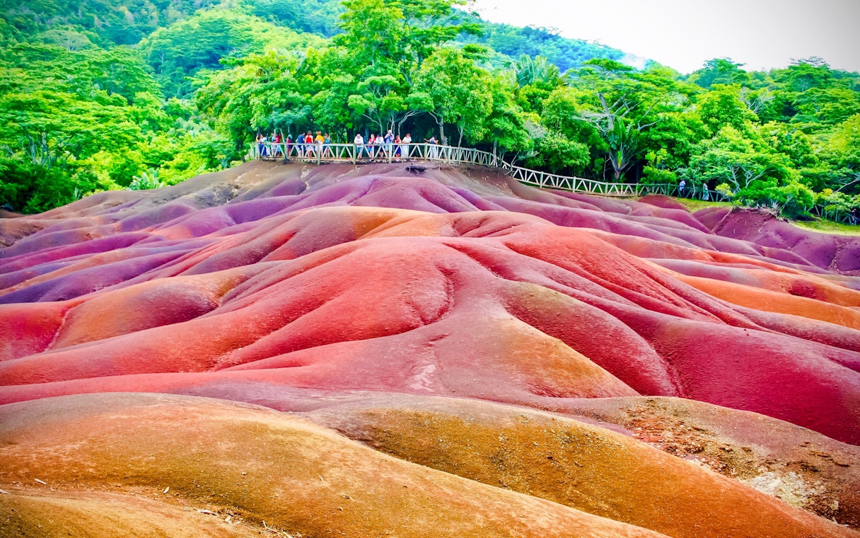 Chamarel 7 Coloured Earth Dunes with tourists on a viewing platform, Mauritius.