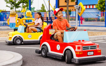 Children driving Lego cars at Legoland New York.