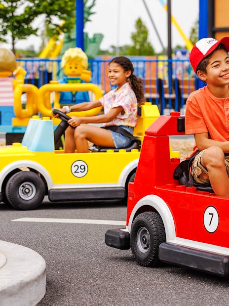 Children driving Lego cars at Legoland New York.